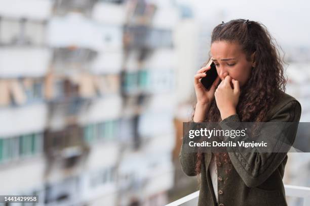 sad business woman having phone conversation - very sad stock pictures, royalty-free photos & images