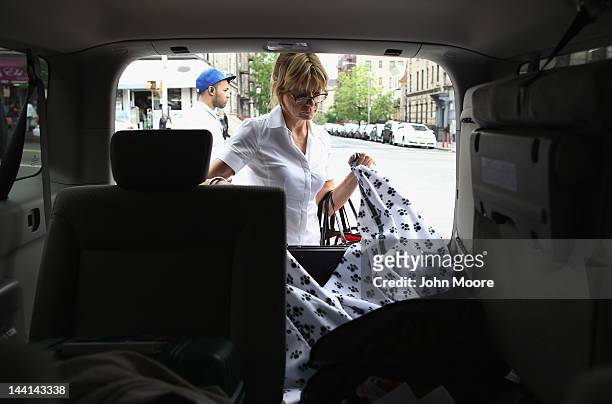 Veterinarian Wendy McCulloch takes out a blanket for use in an in-home pet euthanasia on May 9, 2012 in New York City. McCulloch runs Pet Requiem, a...