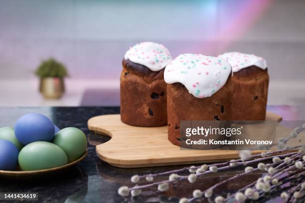 orthodox easter, palm sunday concept. freshly baked easter cakes (kulich), willow branches, painted eggs. selective focus - maundy thursday stock pictures, royalty-free photos & images
