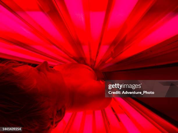 man receiving red light therapy - infrared stock pictures, royalty-free photos & images