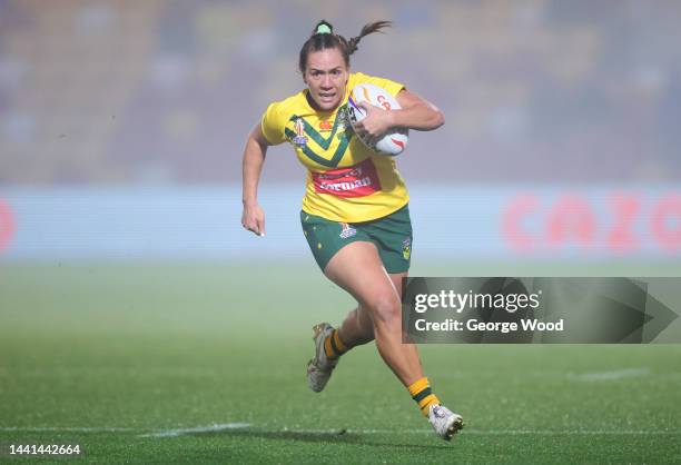 Evania Pelite of Australia breaks with the ball during the Women's Rugby League World Cup Semi-Final match between Australia and Papua New Guinea at...