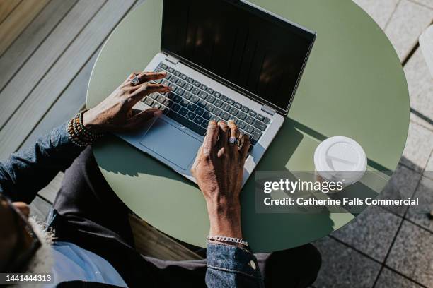 close-up of hands typing on a laptop computer - electronic organizer stock pictures, royalty-free photos & images