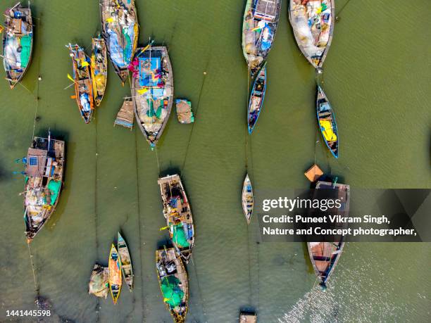 beautiful pattern of small fishing boats docked at the tarabandar jetty near alibaug / alibag in raigad distruct of maharashtra - india tourism stock pictures, royalty-free photos & images