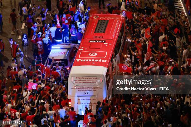 Tunisian fans receive their team's bus on the streets of Doha outside Wyndham Grand Doha West Bay ahead of the FIFA World Cup Qatar 2022 at on...