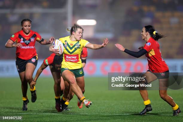 Emma Tonegato of Australia breaks with the ball during the Women's Rugby League World Cup Semi-Final match between Australia and Papua New Guinea at...