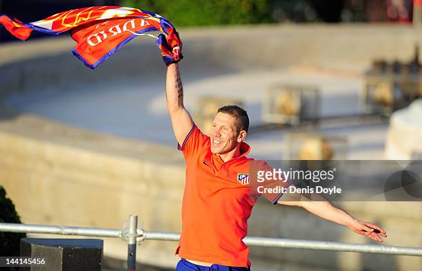 Atletico Madrid head coach Diego Simeone waves to fans at Plaza Neptuno a day after Atletico won the Europa League Final on May 10, 2012 in Madrid,...