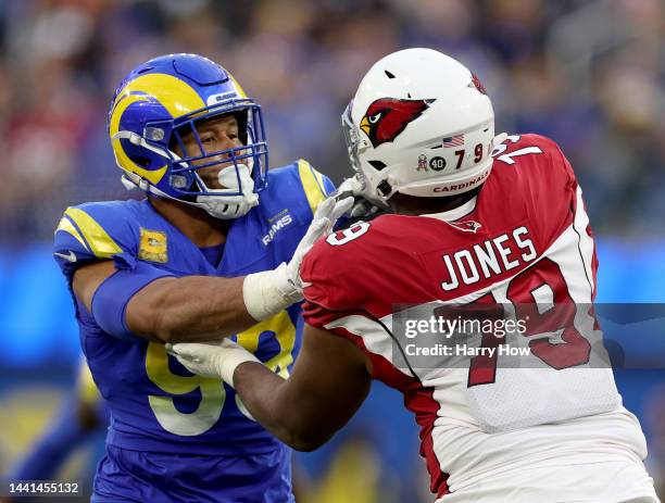 Aaron Donald of the Los Angeles Rams gets blocked by Josh Jones of the Arizona Cardinals during a 27-17 loss to the Arizona Cardinals at SoFi Stadium...