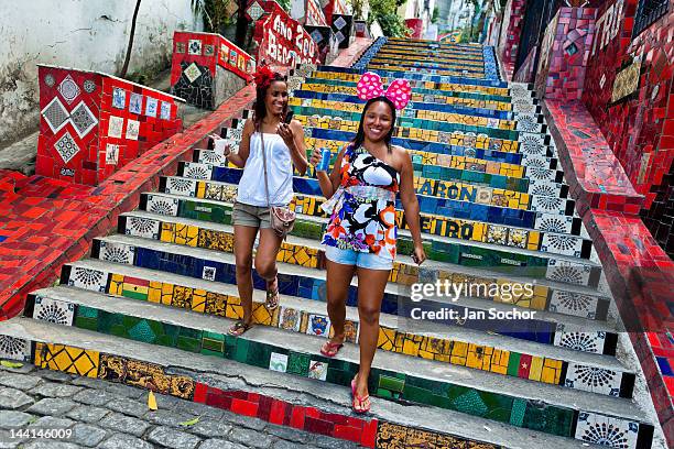 Girls go down the Selaron's Stairs , a mosaic staircase made of colorful tiles, on February 12, 2012 in Rio de Janeiro, Brazil. World famous...