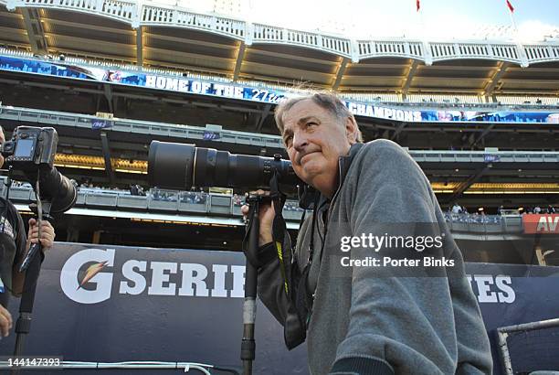 Closeup of New York Times photographer Barton Silverman during Baltimore Orioles vs New York Yankees game at Yankee Stadium. Bronx, NY 5/1/2012...