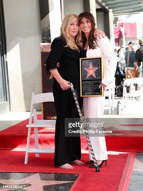 Christina Applegate and Linda Cardellini pose with Christina Applegate's star during her Hollywood Walk of Fame Ceremony at Hollywood Walk Of Fame on...