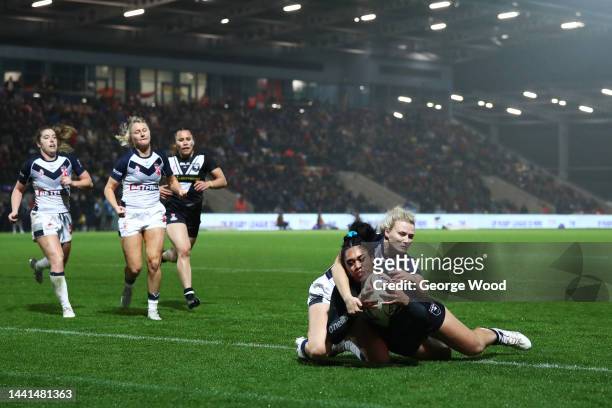 Otesa Pule of New Zealand goes over to score their sides third try during the Women's Rugby League World Cup Semi-Final match between England and New...