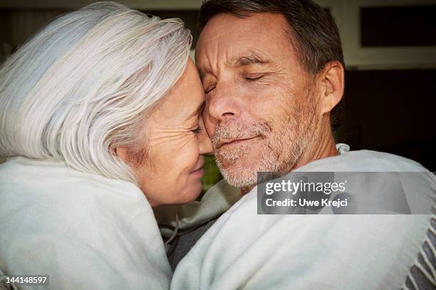 mature couple embracing, close-up - falling in love bildbanksfoton och bilder