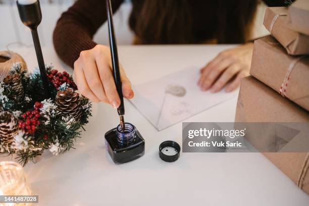 writing a letter for holidays - vulpen stockfoto's en -beelden