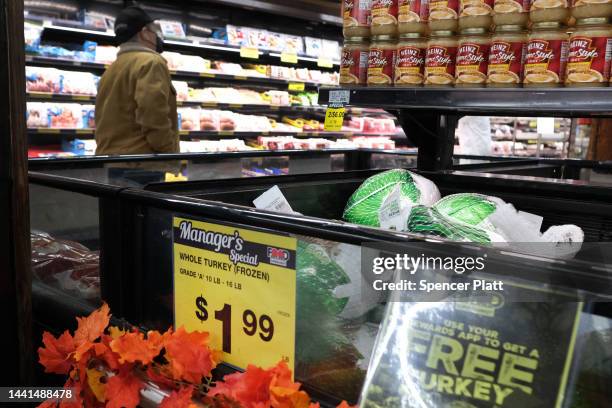 Frozen turkeys are displayed for sale inside a grocery store on November 14, 2022 in New York City. The price of turkeys, a staple for many Americans...