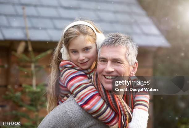 father and daughter smiling together. - kopfschutz stock-fotos und bilder