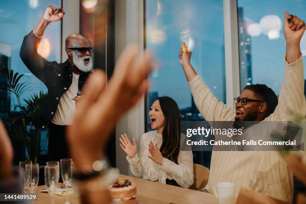 colleagues enjoy an after-work office party - happy colleagues doing team building activity imagens e fotografias de stock