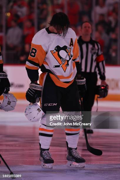 Kris Letang of the Pittsburgh Penguins stands for the national anthem just prior to a game against the Washington Capitals at Capital One Arena on...