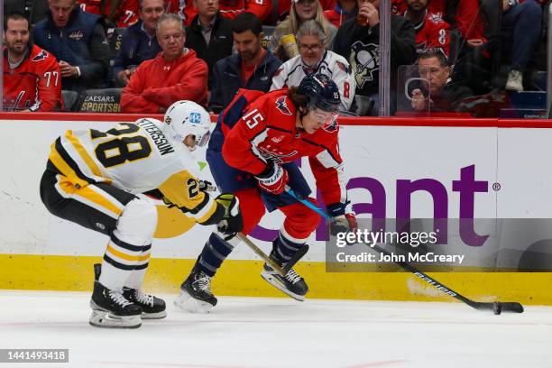 Sonny Milano of the Washington Capitals speeds past Marcus Pettersson of the Pittsburgh Penguins during a game at Capital One Arena on November 9,...