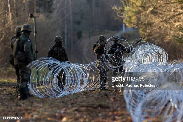 Soldiers of the Polish army installing concertina wire at Poland's border with Russian exclave Kaliningrad on November 14, 2022 in Goldap, Poland....