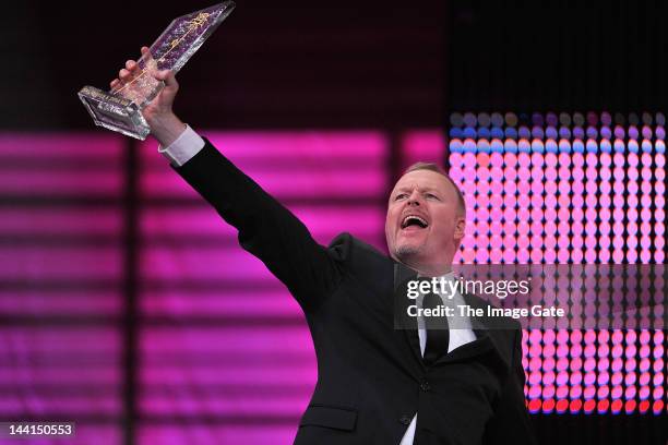 Stefan Raab gestures as he receives the Innovation Rose Award during the Rose d'Or television festival award ceremony held at the KKL on May 10, 2012...