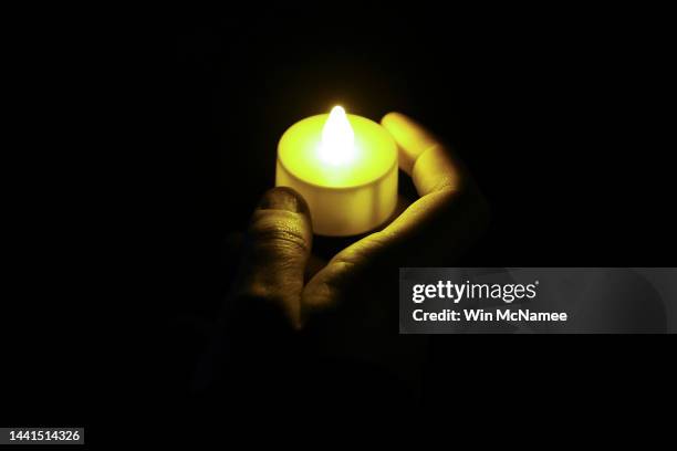 Members of the University of Virginia community attend a candlelight vigil on the South Lawn for the victims of a shooting overnight at the...