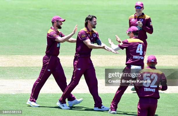 Kane Richardson of Queensland celebrates the wicket of Marcus Harris of Victoria during the Sheffield Shield match between Queensland and Victoria at...