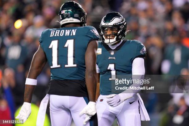 Jalen Hurts of the Philadelphia Eagles celebrates with teammate A.J. Brown after scoring a touchdown against the Washington Commanders during the...