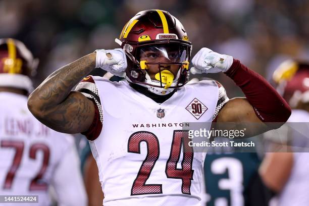 Antonio Gibson of the Washington Commanders celebrates after scoring a touchdown against the Philadelphia Eagles during the first quarter in the game...