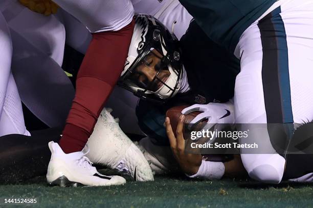 Jalen Hurts of the Philadelphia Eagles scores a touchdown against the Washington Commanders during the first quarter in the game at Lincoln Financial...