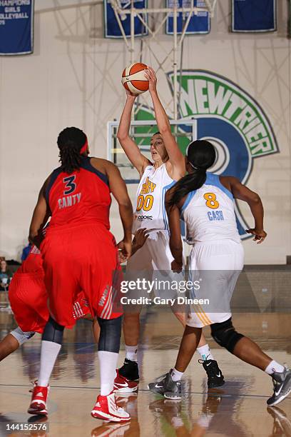 Ruth Riley of the Chicago Sky looks for teammate Swin Cash while defended by Dominique Canty of the Washington Mystics during the pre-season game on...