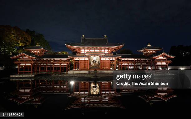 Phoenix Hall of Byodoin Temple is illuminated on November 14, 2022 in Uji, Kyoto, Japan.