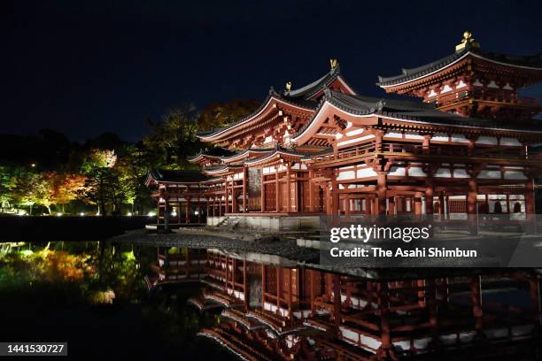 Phoenix Hall of Byodoin Temple is illuminated on November 14, 2022 in Uji, Kyoto, Japan.