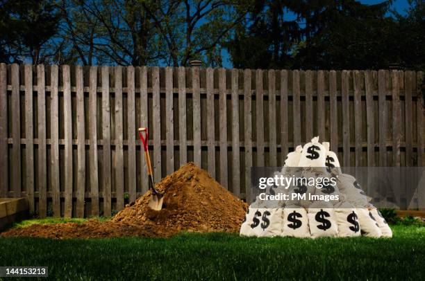 burying money in the back yard - burying money stock pictures, royalty-free photos & images