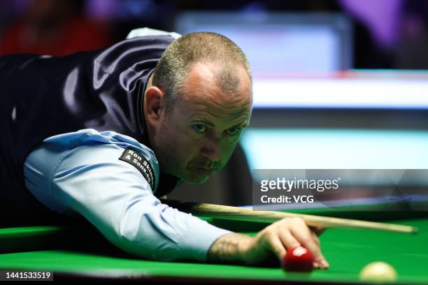 Mark Williams of Wales plays a shot during the first round match against Jamie Clarke of Wales on day 3 of 2022 Cazoo UK Championship at Barbican...