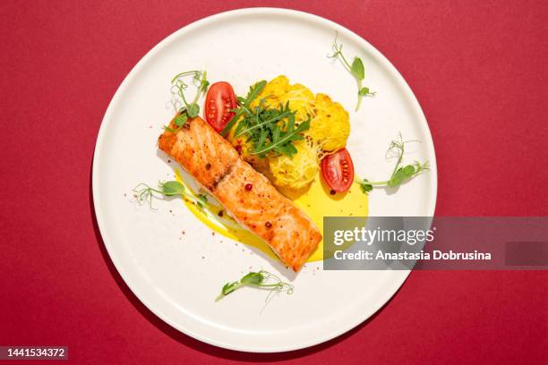 salmon steak with garnish. top view. - serving dish stock pictures, royalty-free photos & images