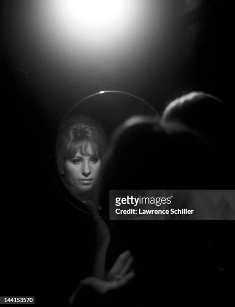 American singer and actress Barbra Streisand reflected in a mirror during the filming of 'On a Clear Day You Can See Forever' , Los Angeles,...