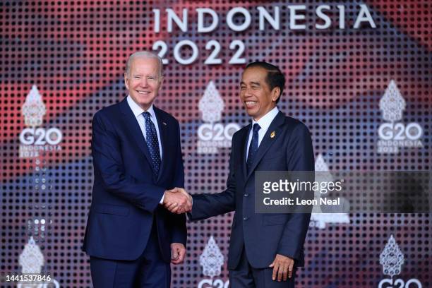 President Joe Biden of the United States is greeted by the President of the Indonesian Republic Joko Widodo during the formal welcome ceremony to...