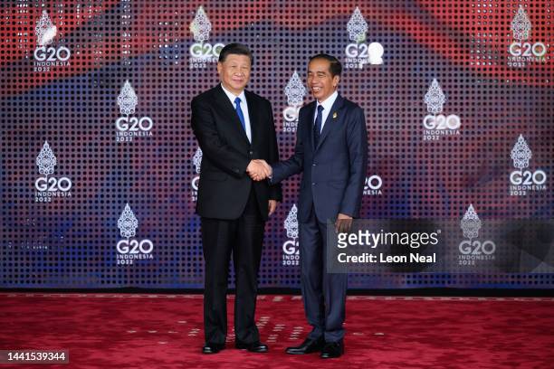 President Xi Jinping of China is greeted by the President of the Indonesian Republic Joko Widodo during the formal welcome ceremony to mark the...