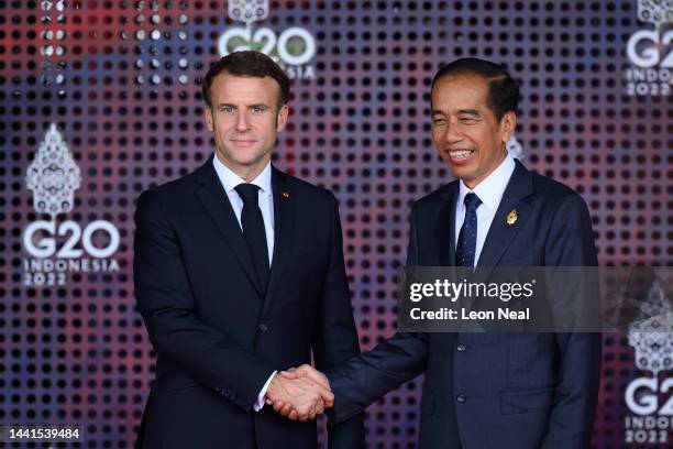 President Emmanuel Macron of France is greeted by the President of the Indonesian Republic Joko Widodo during the formal welcome ceremony to mark the...