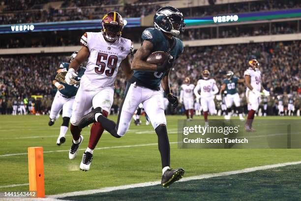 DeVonta Smith of the Philadelphia Eagles scores a touchdown against the Washington Commanders during the third quarter in the game at Lincoln...