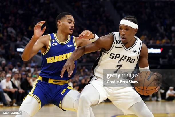 Josh Richardson of the San Antonio Spurs is guarded by Jordan Poole of the Golden State Warriors at Chase Center on November 14, 2022 in San...