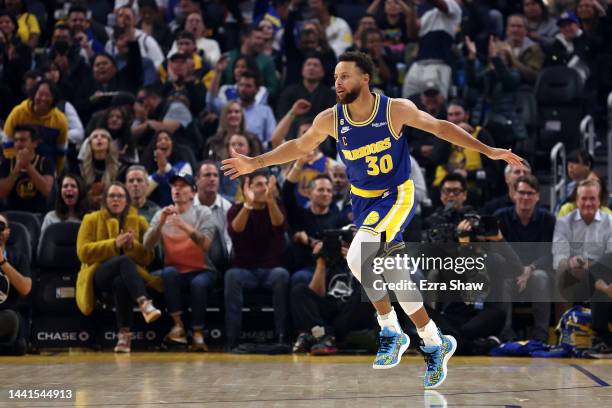 Stephen Curry of the Golden State Warriors reacts after making a three-point basket against the San Antonio Spurs at Chase Center on November 14,...