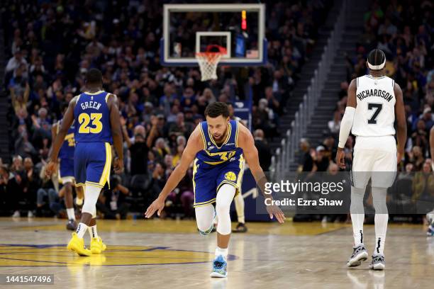 Stephen Curry of the Golden State Warriors reacts after making a three-point basket against the San Antonio Spurs at Chase Center on November 14,...