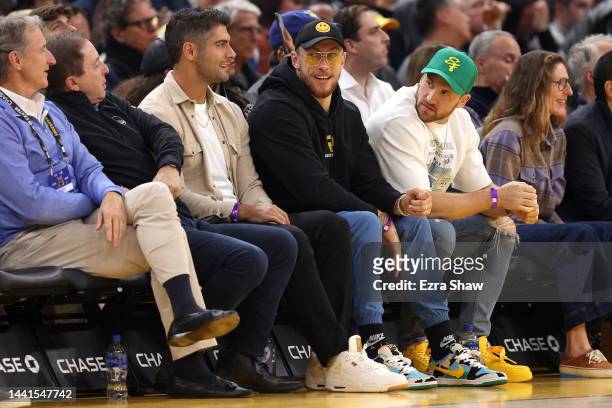 Golden State Warriors owner Joe Lacob talks with Jimmy Garoppolo, George Kittle, and Kyle Juszczyk of the San Francisco 49ers at Chase Center on...