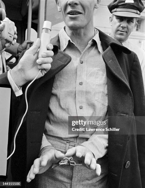 Convicted smuggler Frank C. Weatherman answers questions from reporters as he leaves Alcatraz, the last prisoner to do so before the facility was...