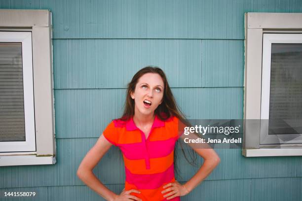 woman rolling eyes, displeased woman negative attitude, irritated woman mocking - impatient stock-fotos und bilder