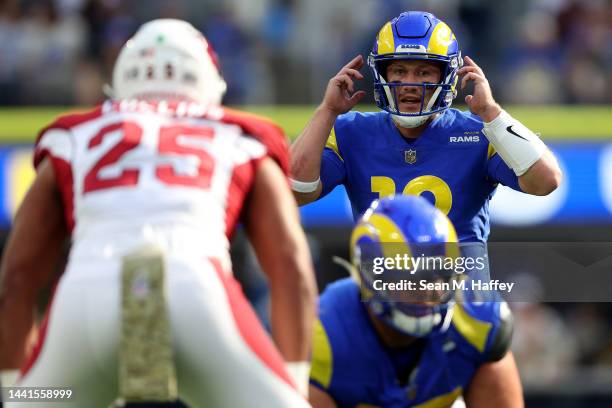 John Wolford of the Los Angeles Rams calls a play at the line of scrimmage during a game against the Arizona Cardinals at SoFi Stadium on November...