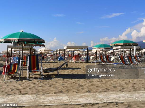 beach at marina di pietrasanta, versilia, tuscany - bath house stockfoto's en -beelden