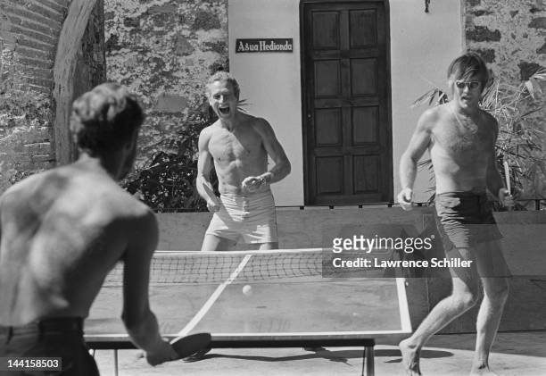 American actors Paul Newman and Robert Redford play ping-pong during a break in the filming of their movie 'Butch Cassidy and the Sundance Kid' ,...