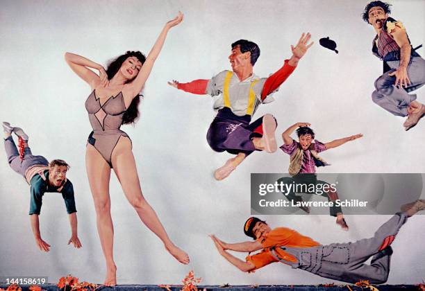 Composite promotional portrait of American actress Julie Newmar, in costume as 'Stupefyin' Jones,' and other various cast members from 'Li'l Abner' ,...